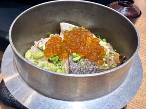 Kamameshi - a slow-cooked mixed rice dish cooked in a “kama”- a traditional iron pot.