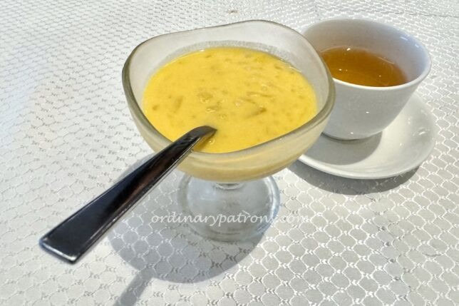 dessert of cream of pomelo and mango with sago