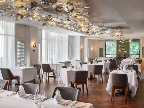 FLUTES Restaurant Reopens in Historic Midtown House