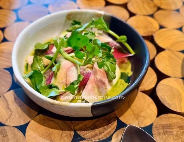 ceviche of local mahi mahi with pink guava and garden herbs.