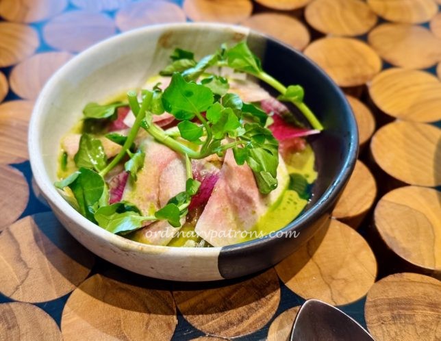 ceviche of local mahi mahi with pink guava and garden herbs.