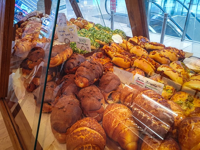 Noci Bakehouse pastries behind glass shelves.