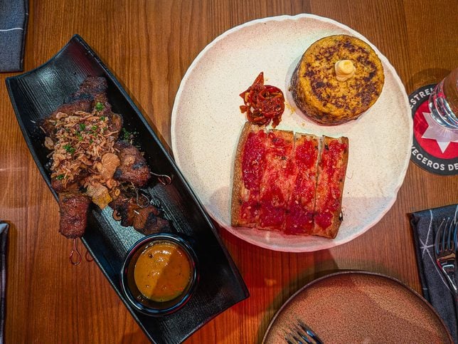 Spanish Omelette with Coca Bread ($18), andJosper Grilled Iberico Pork Collar ($16) at Pura Brasa PLQ